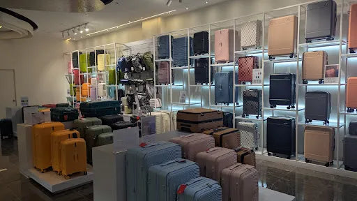 Case Valker luggage store featuring colorful suitcase displays inside a modern retail space